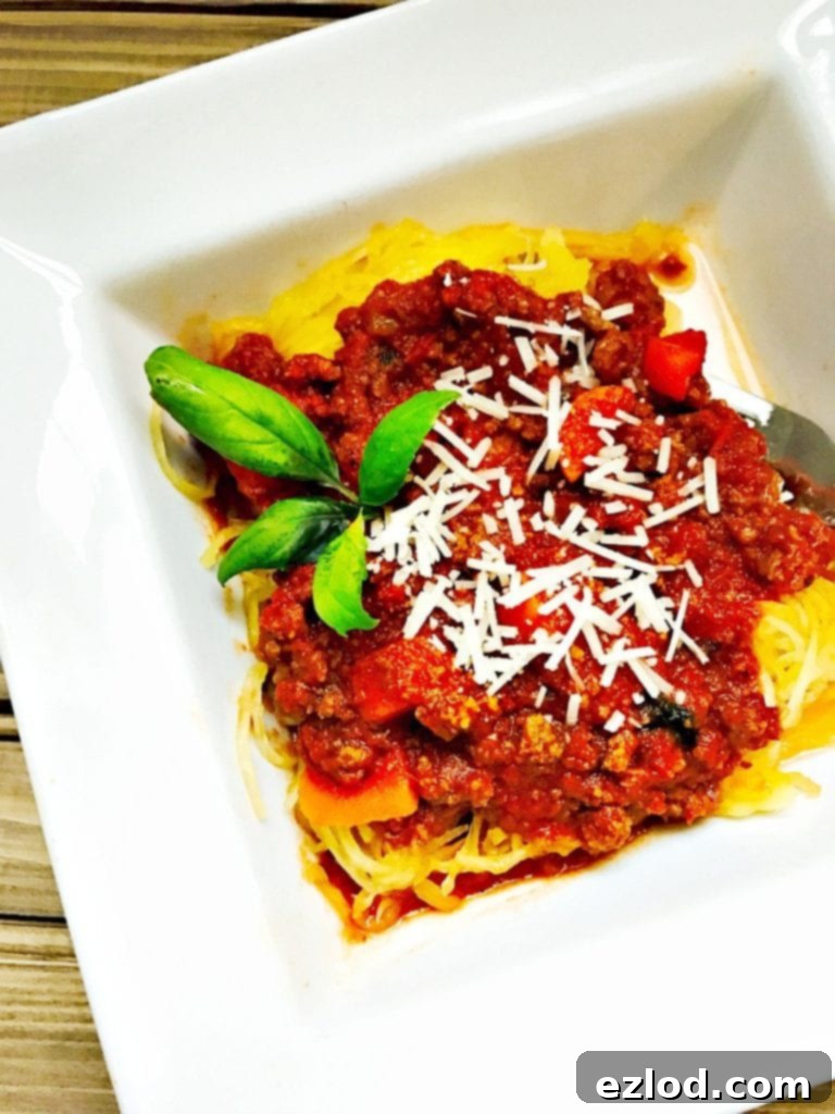 Spaghetti squash with meat sauce in a bowl, a healthy and comforting meal option.