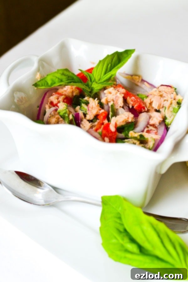 No-Mayo Mediterranean Tuna Salad in a bowl with fresh herbs, a healthy and quick meal idea.
