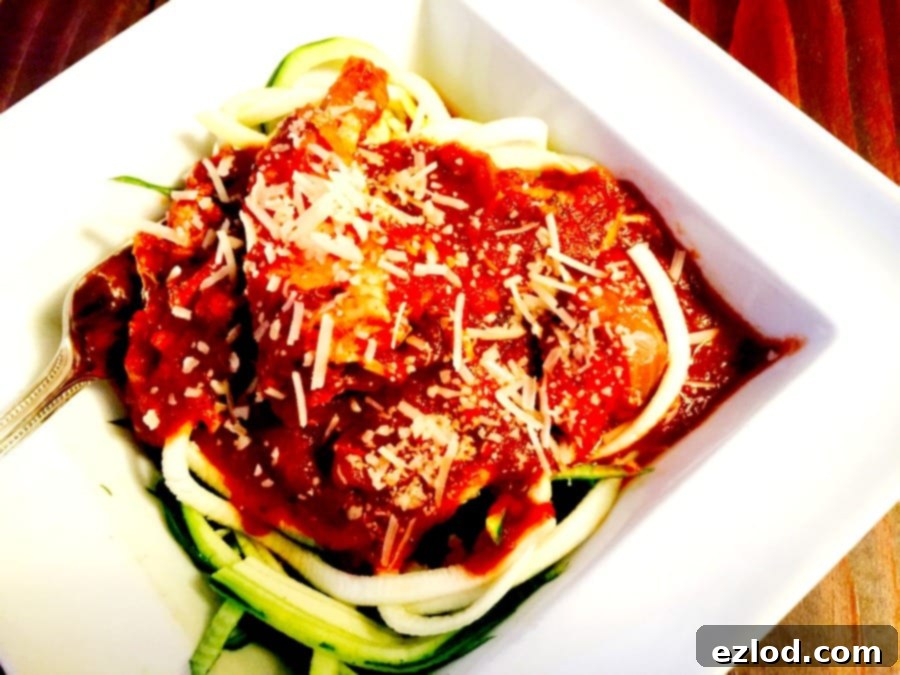 Instant Pot Balsamic Chicken in a bowl, garnished with fresh herbs, ready to serve.