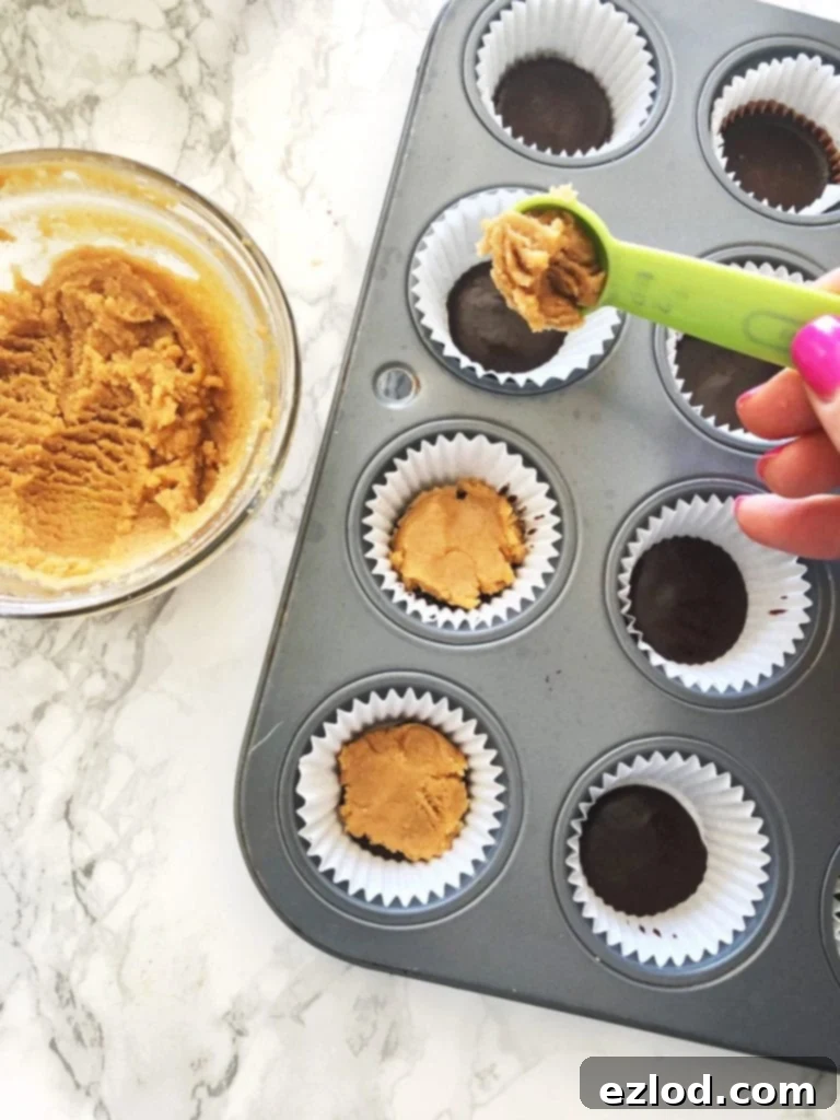 Healthy Copycat Mini Reese’s Peanut Butter Cups in cupcake liners, a sweet and healthy treat.
