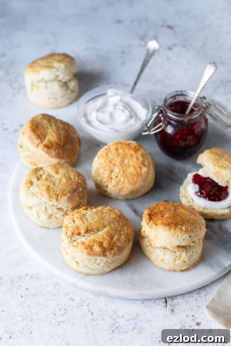 Vegan scones on a marble platter on a white background.