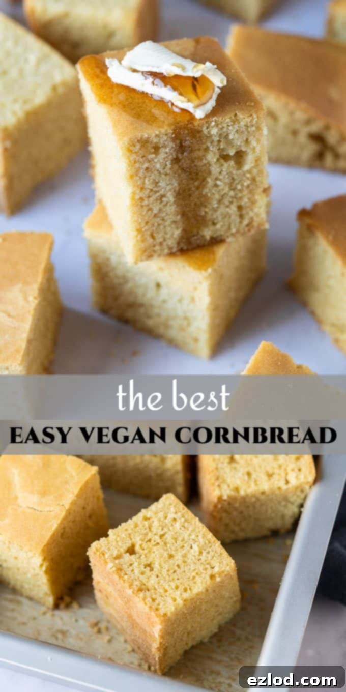 Pinterest optimized image showing a stack of two vegan cornbread squares topped with butter and maple syrup, with recipe text overlay.