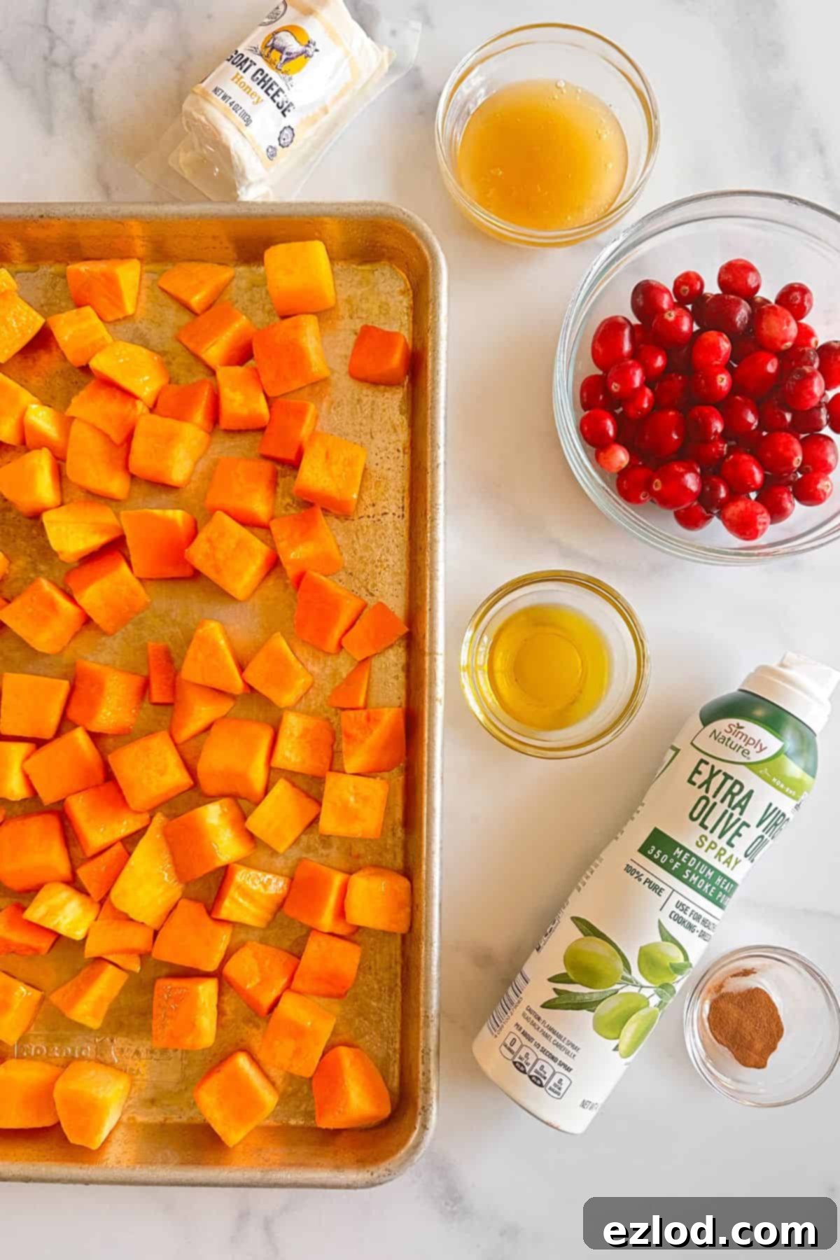 Ingredients for Roasted Butternut Squash with honey, cinnamon, cranberries, and goat cheese.