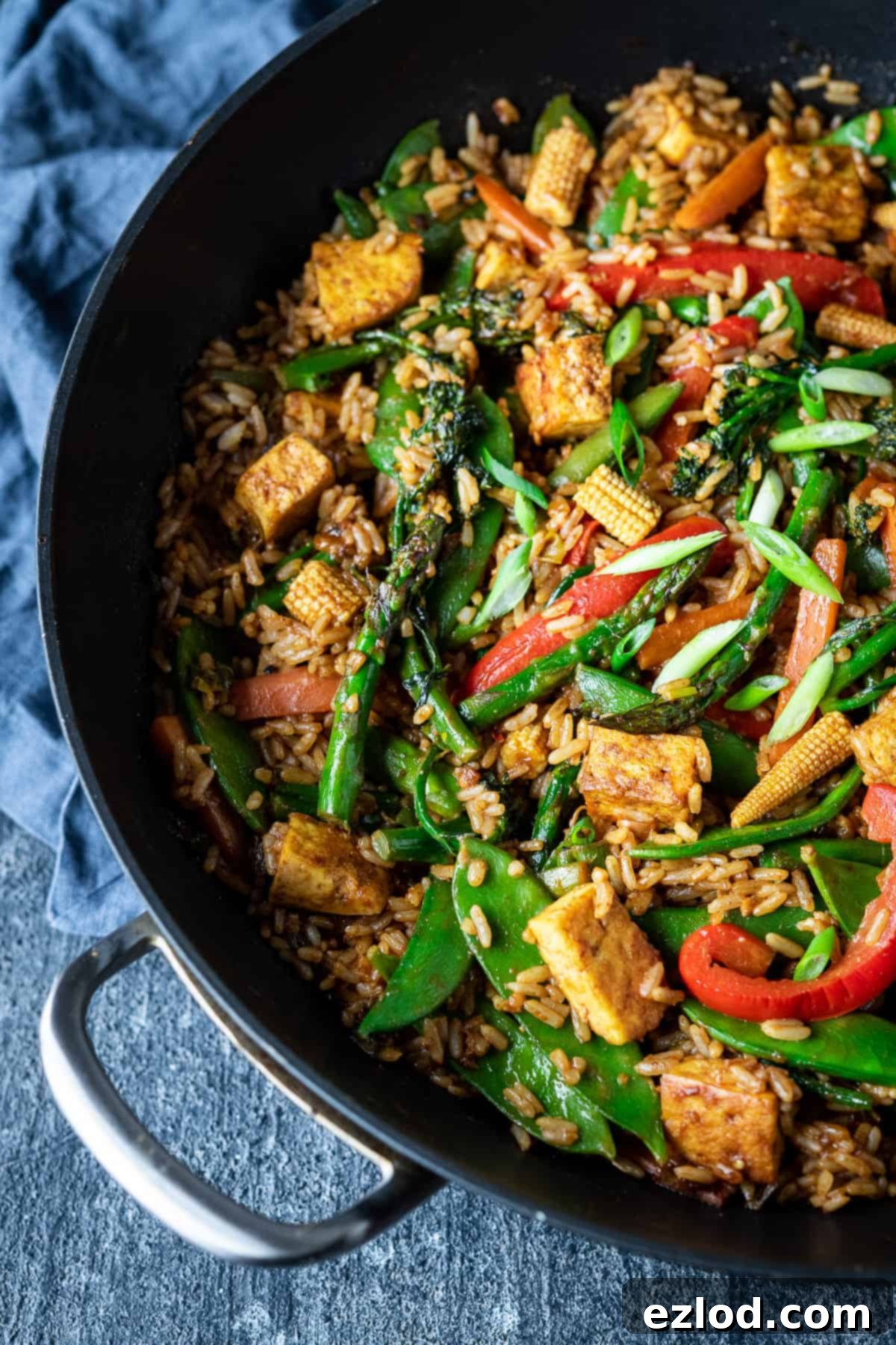 vegetable peanut fried rice in a black wok.