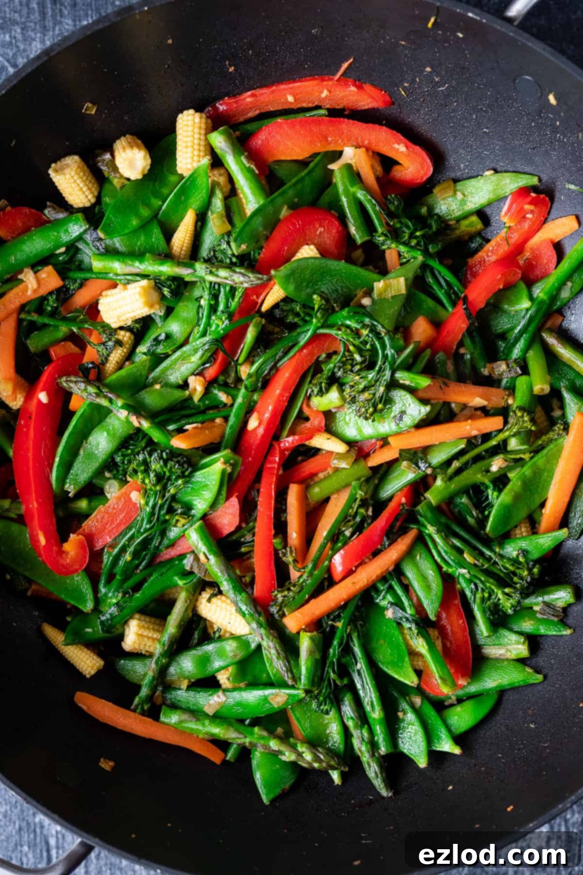 stir fried vegetables in a wok