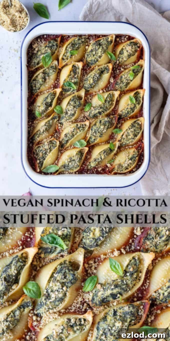 Pinterest image for Vegan Spinach and Ricotta Stuffed Pasta Shells, showing a baked dish with fresh basil and vegan parmesan, on a marble background.