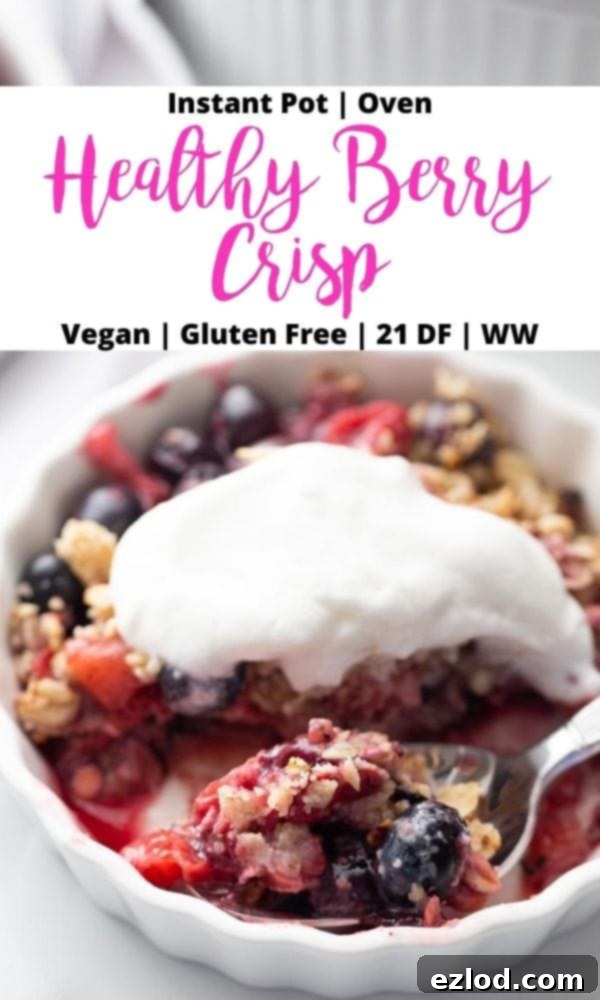 An inviting photo of an individual ramekin of berry crisp, elegantly topped with homemade coconut cream. A black and pink text overlay highlights its features: Instant Pot | Oven | Healthy Berry Crisp | Vegan | Gluten Free | 21 DF | WW.