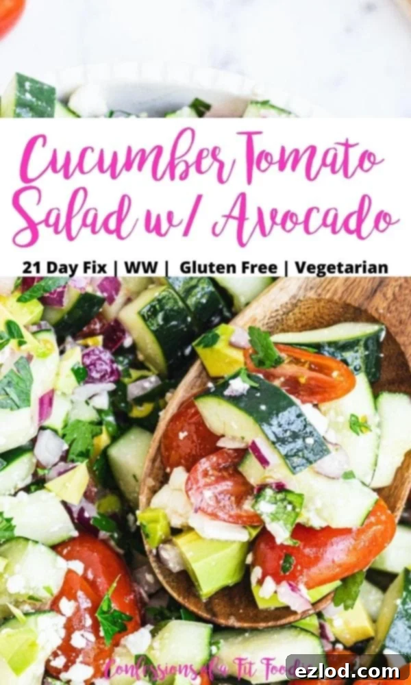 Close up photo of chopped salad on a wooden spoon with a black and pink text overlay on a white rectangle. The text overlay says, Cucumber Tomato Salad with Avocado | 21 Day Fix | WW | Gluten Free | Vegetarian | Confessions of a Fit Foodie