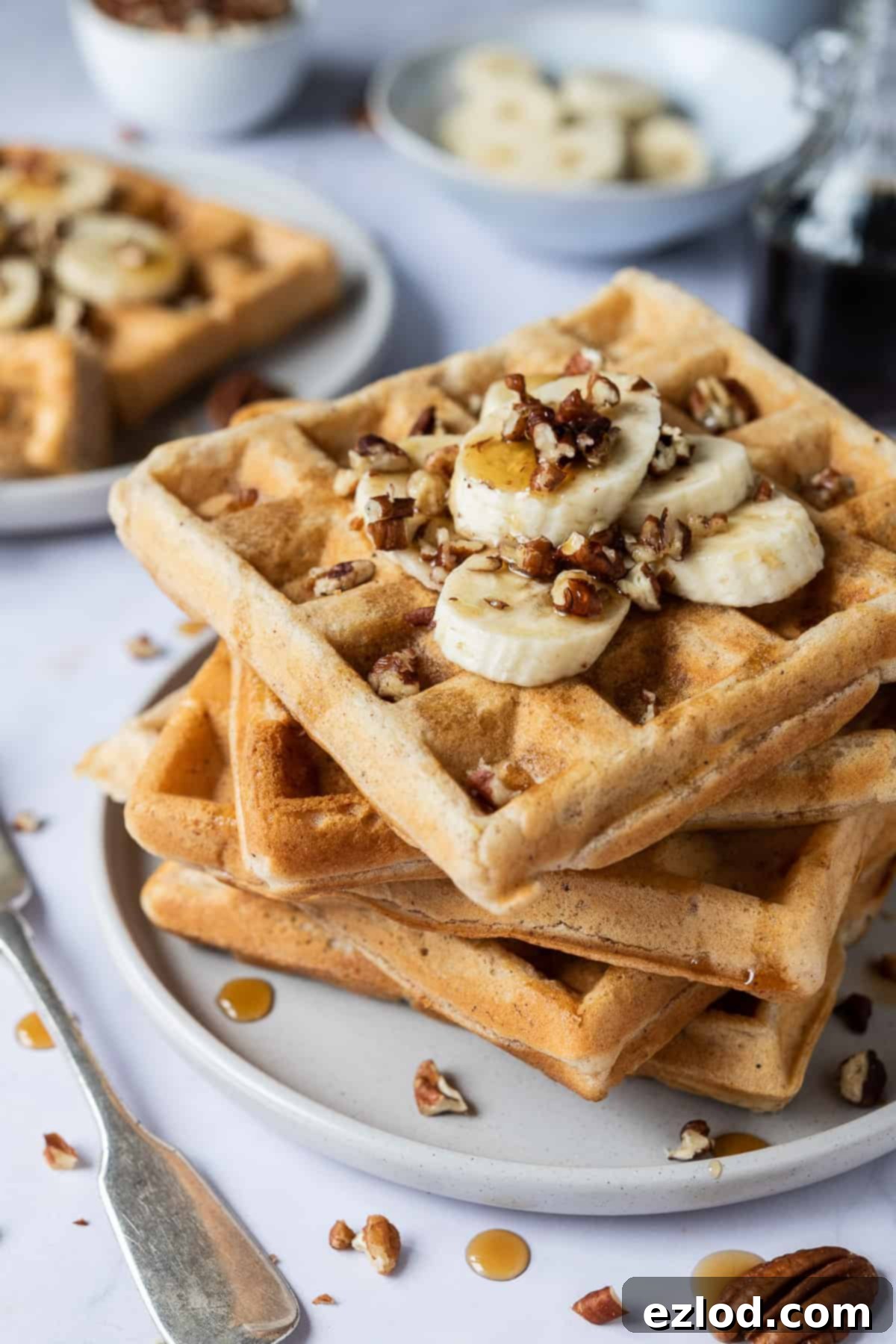 a stack of perfectly cooked vegan banana waffles, golden brown and inviting.