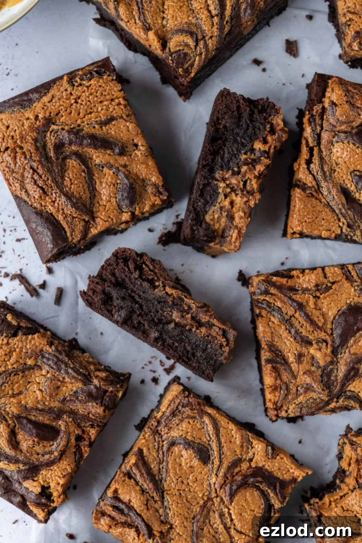 Close up of squares of peanut butter swirl brownies.