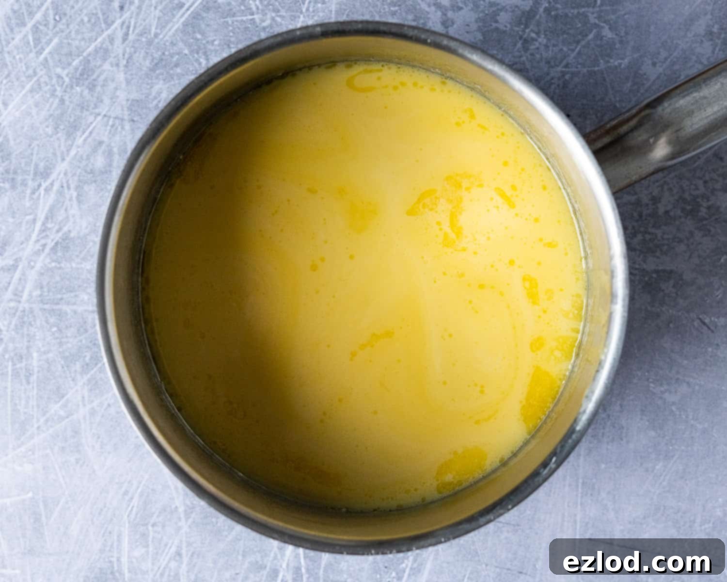 Step 1: Non-dairy milk and vegan butter mixture gently heating in a saucepan.