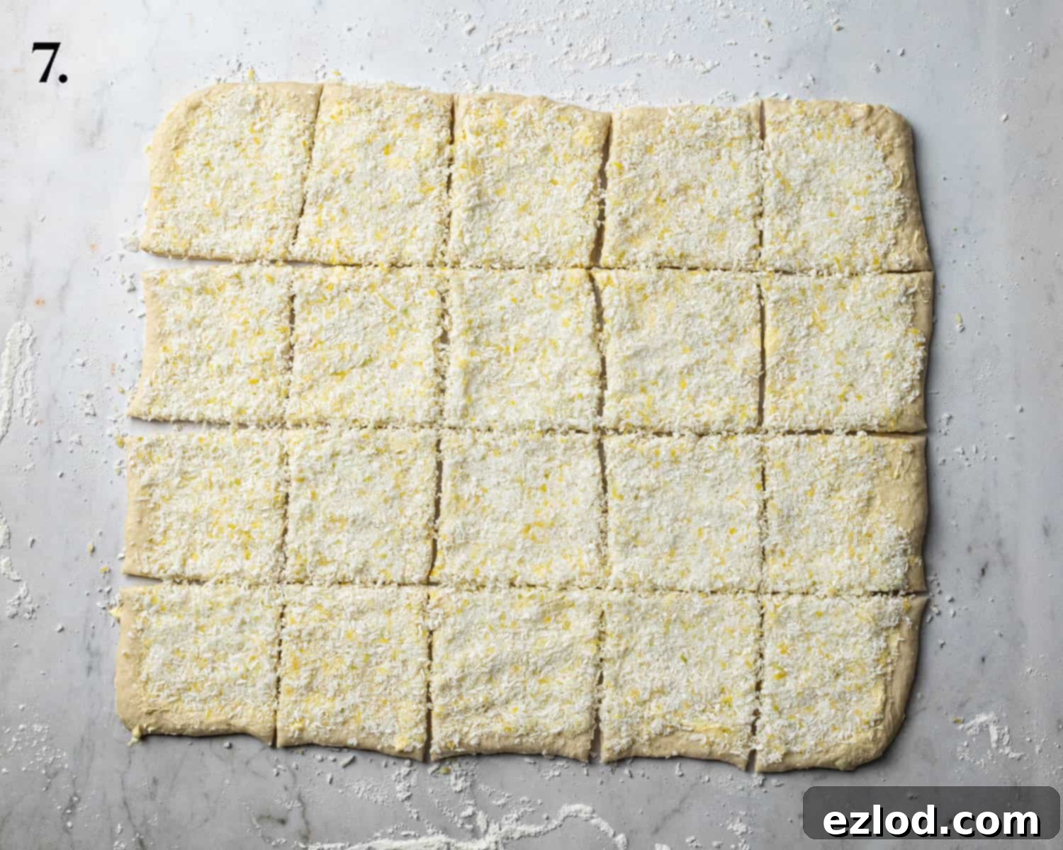 Step 7, the dough with the filling mixture added and sliced into squares.