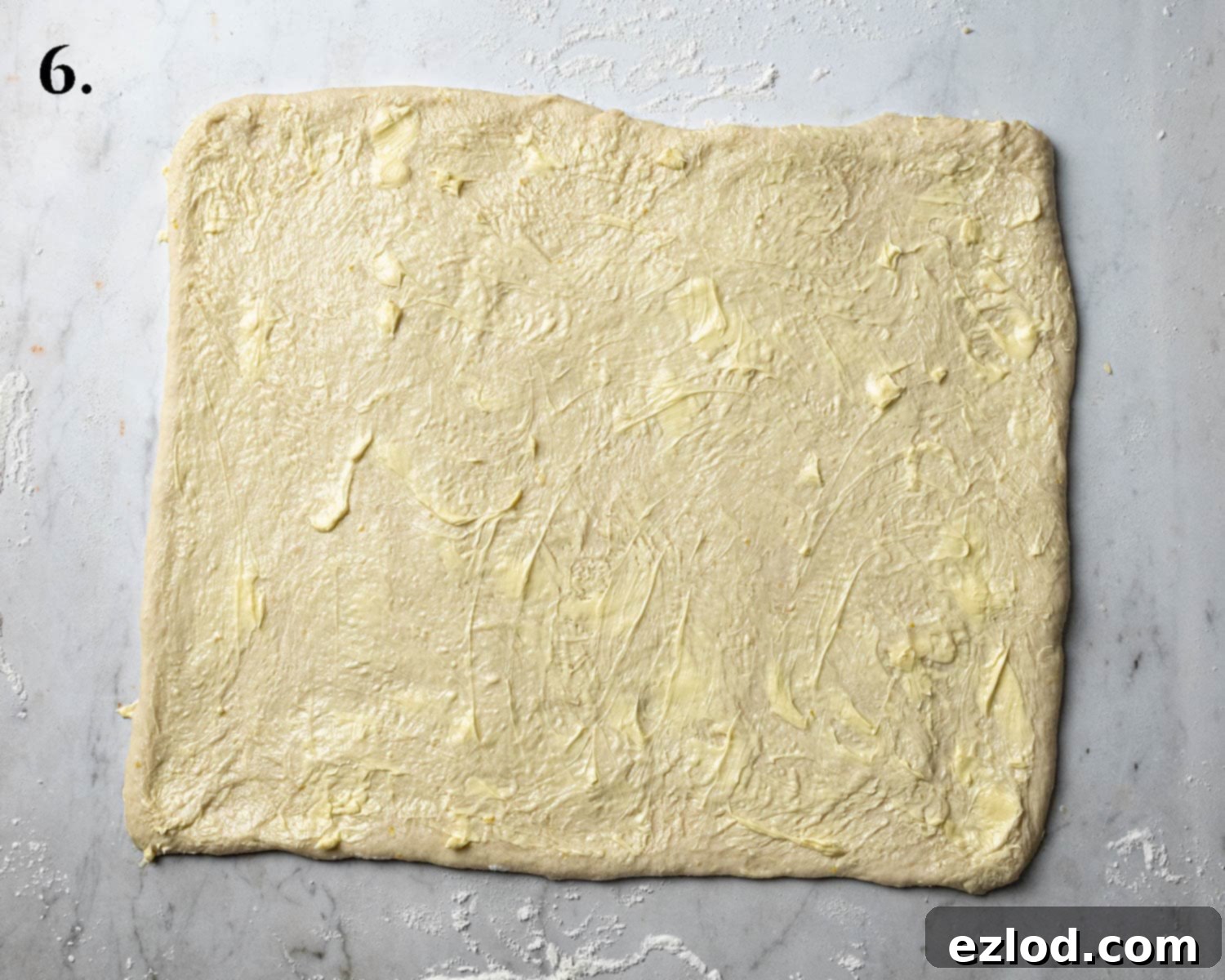 Step 6, the rolled out dough with the butter spread over.