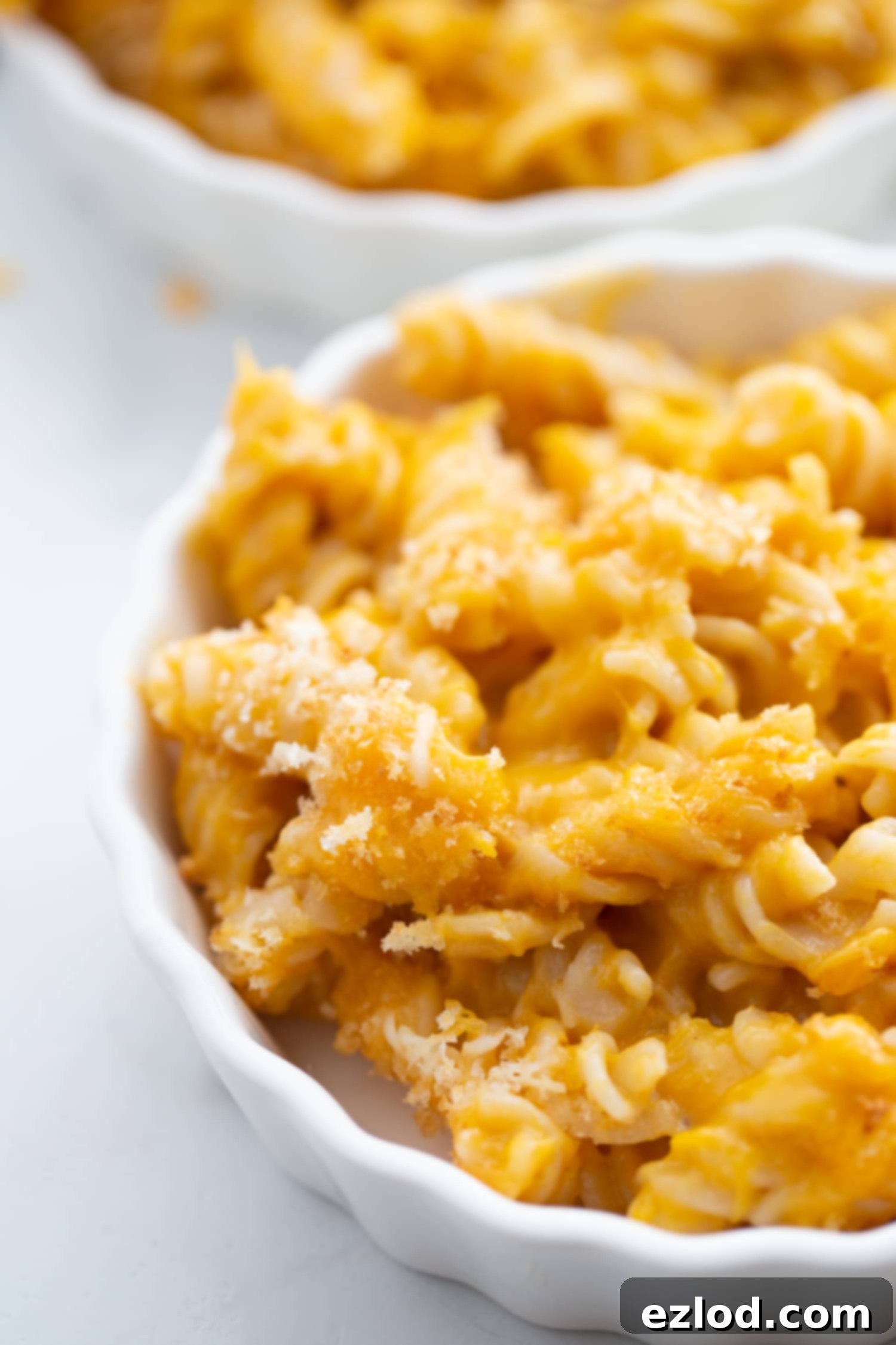 close up photo of mac and cheese in a white ramekin