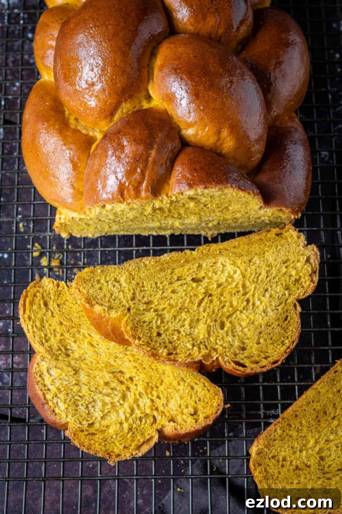 Close up of sliced vegan pumpkin challah bread.