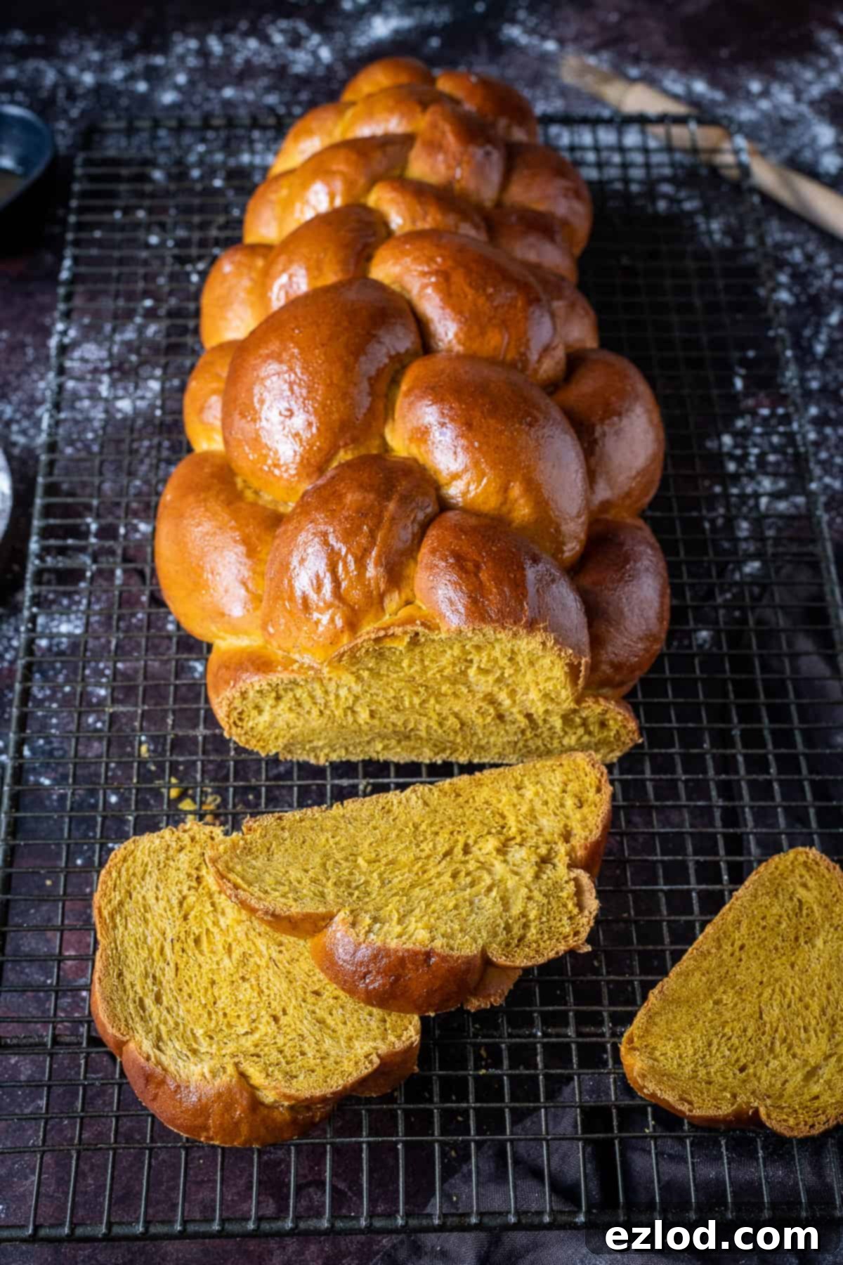 Sliced vegan pumpkin challah bread.