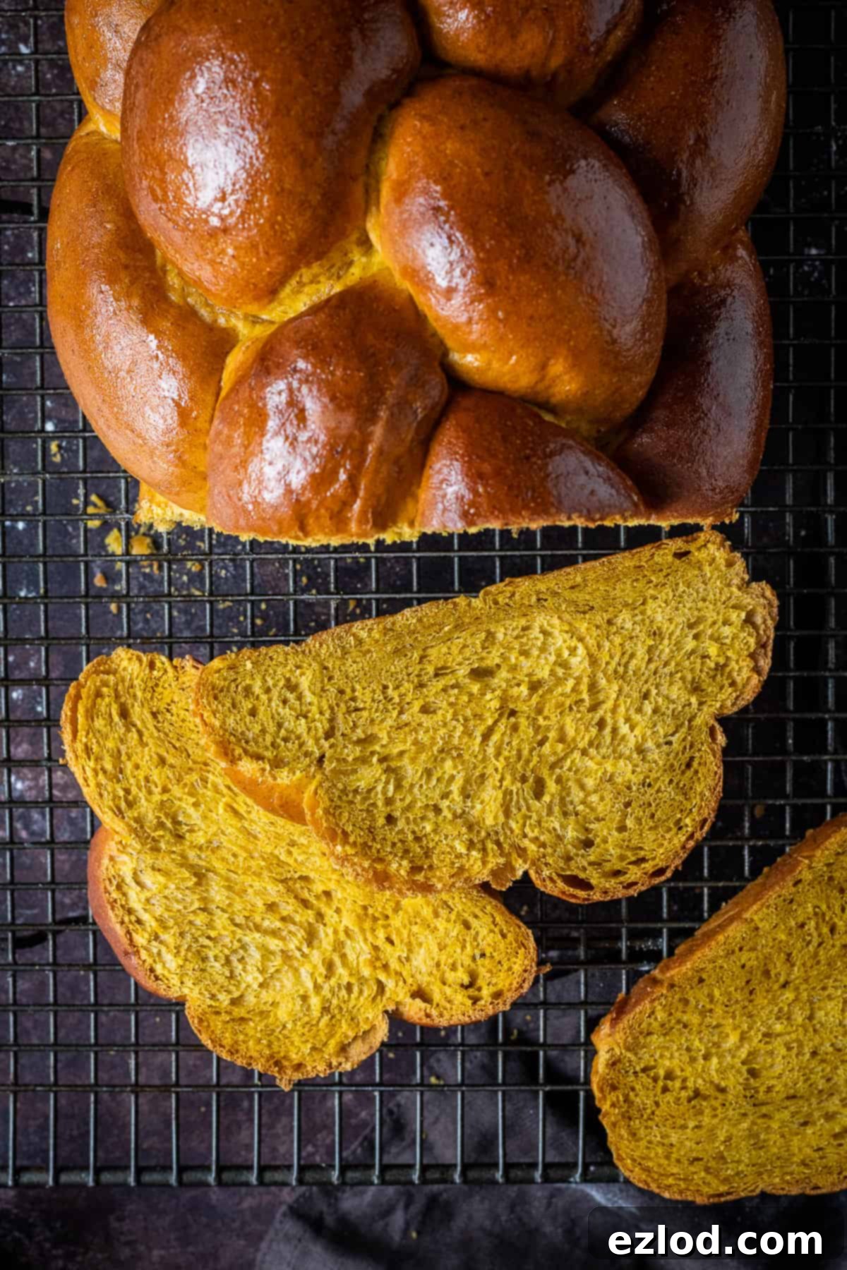 Close up of sliced pumpkin challah bread.
