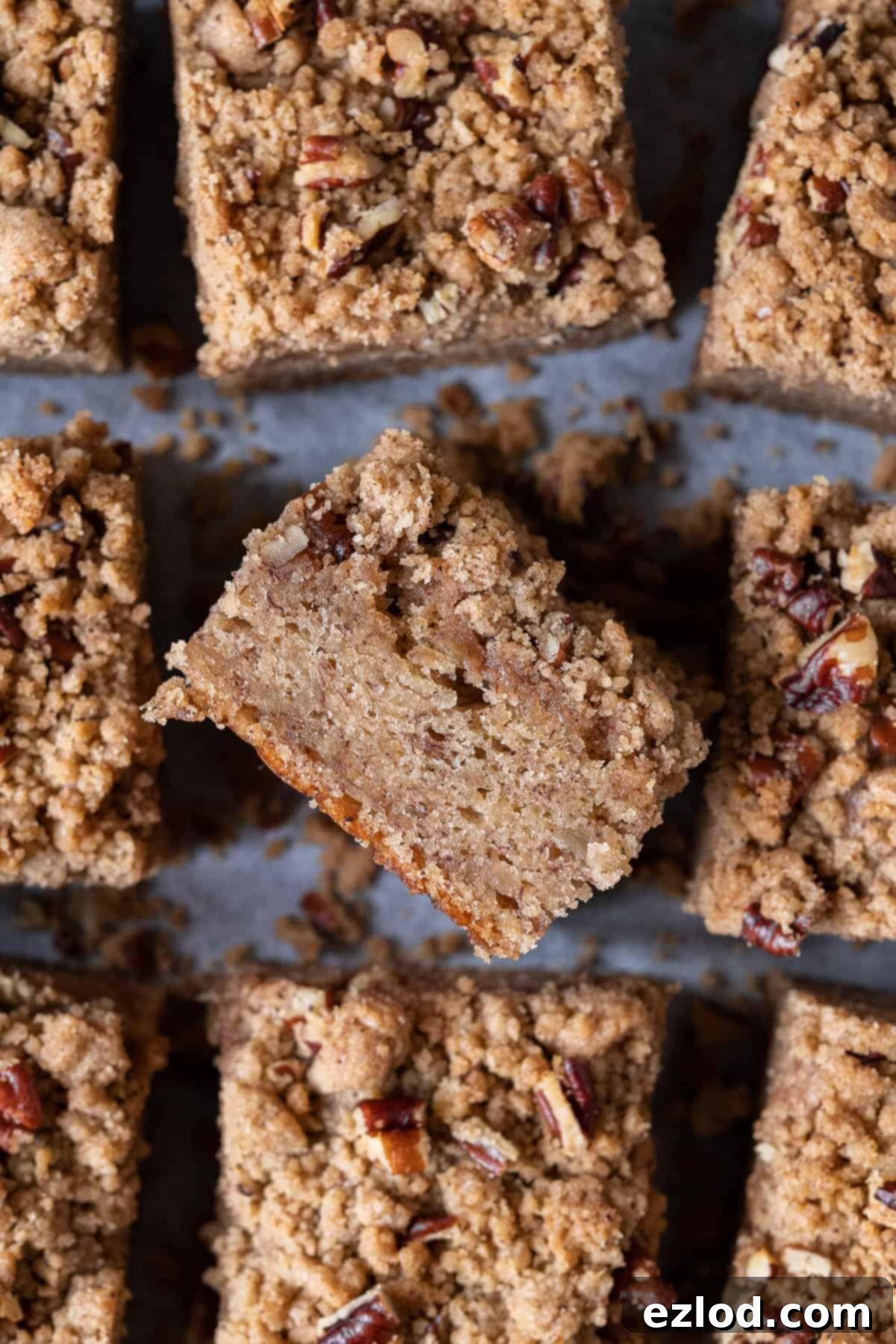 Close up of a square of vegan banana crumb cake on it's side.