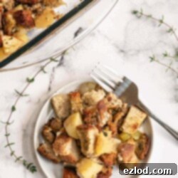 Savory Apple Sausage Gluten-Free Stuffing 3 Gluten-Free Stuffing with Sausage and Apples in a baking dish