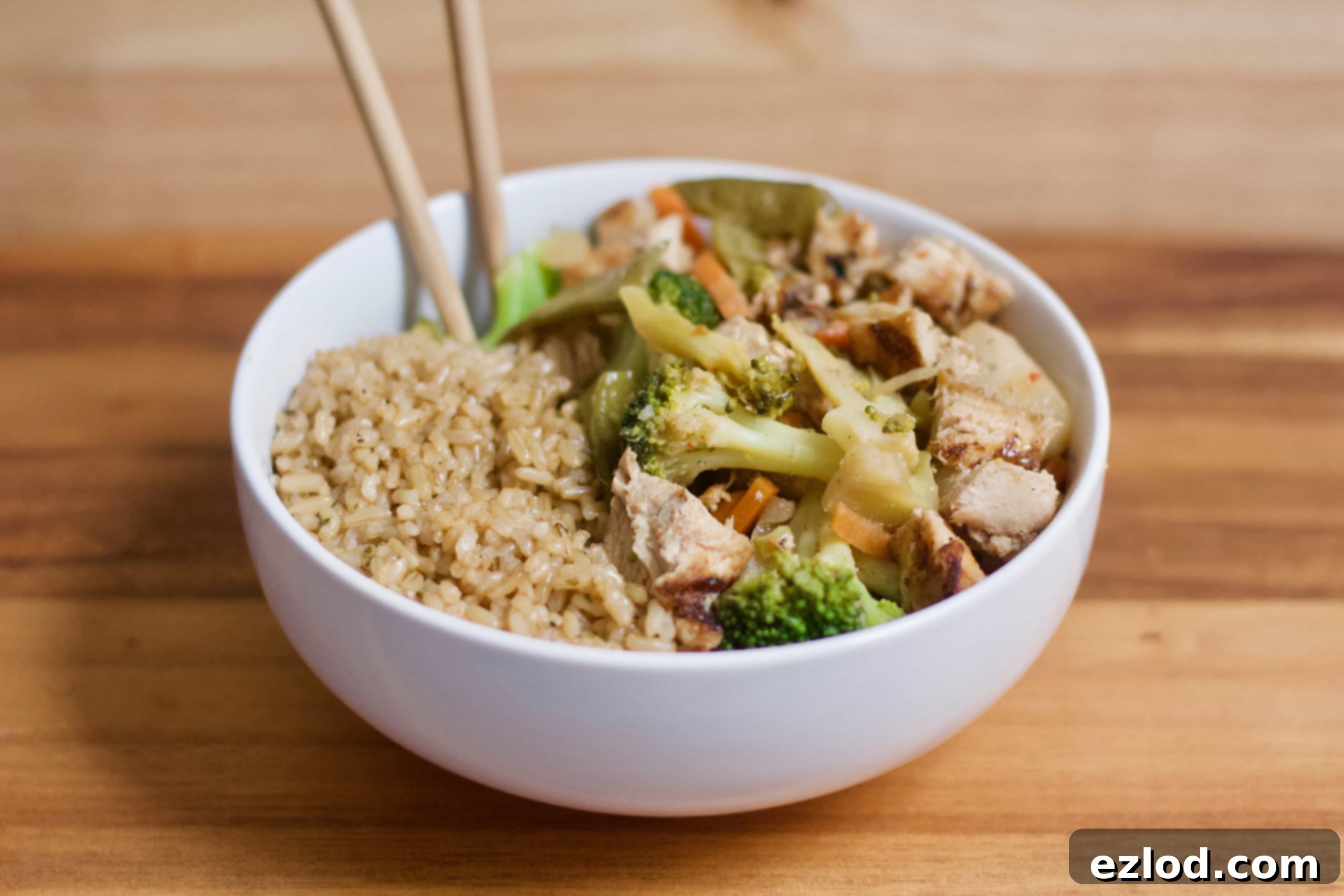 Overhead shot of 21 Day Fix Chicken and Veggie Stir Fry with a portion scooped onto a plate