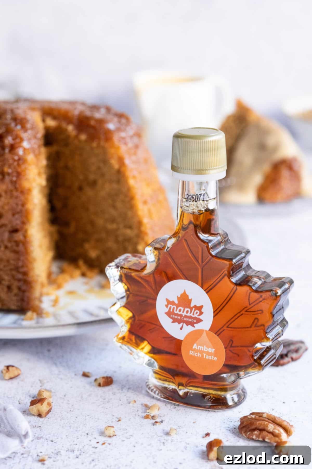 A bottle of pure Canadian maple syrup shaped like a maple leaf, emphasizing the natural ingredient.