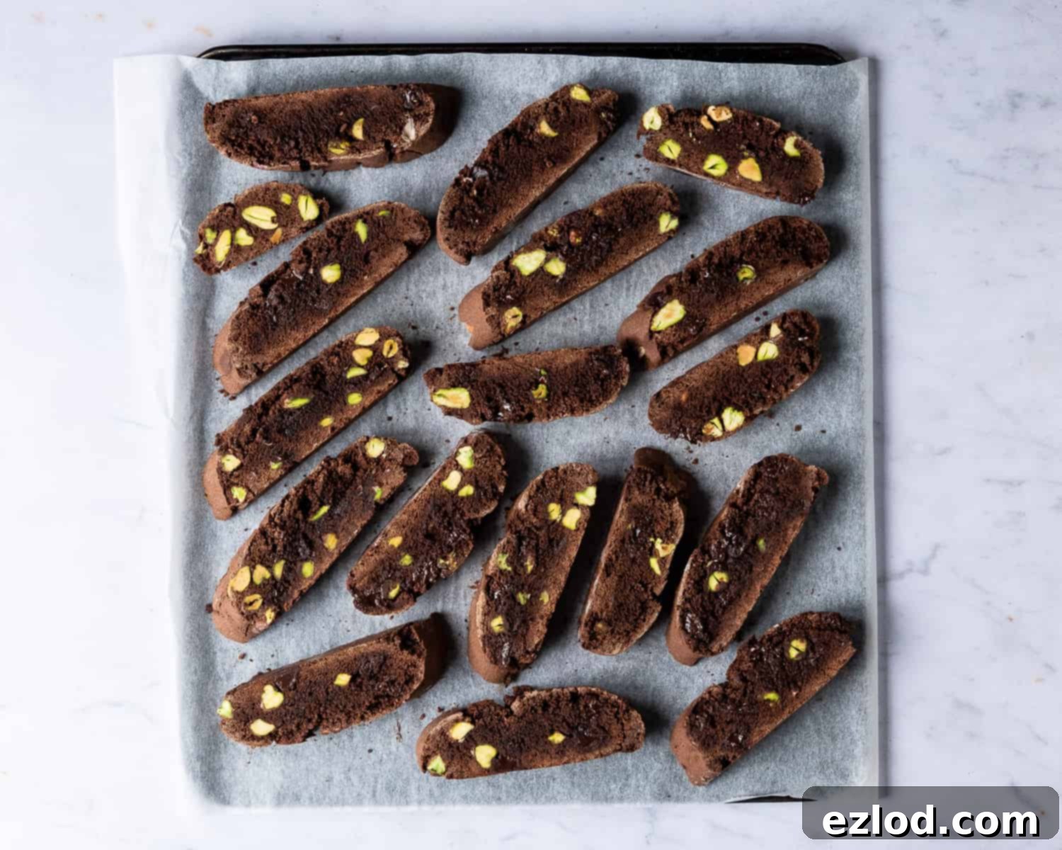 Step 5: The second baking process, showing biscotti slices arranged on a baking sheet for ultimate crispness.