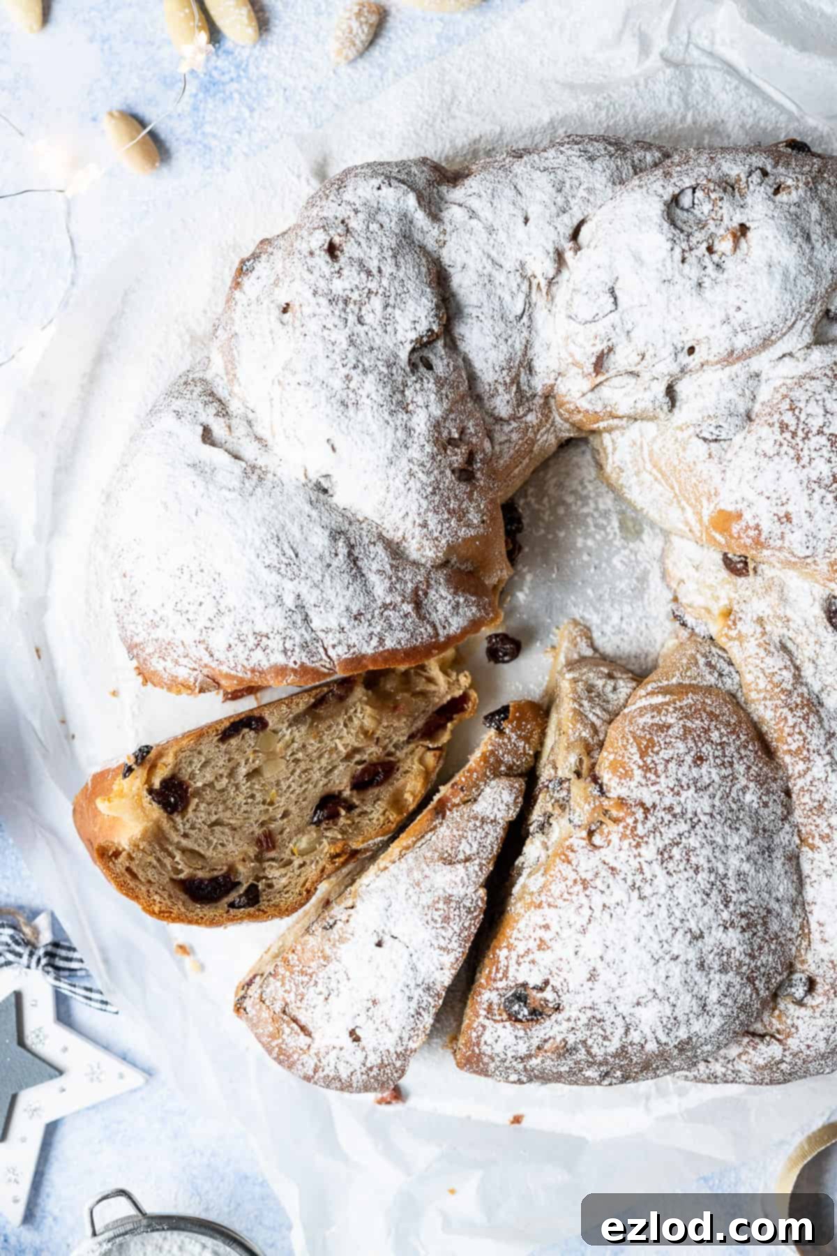 Vegan stollen wreath with two slices cut out.