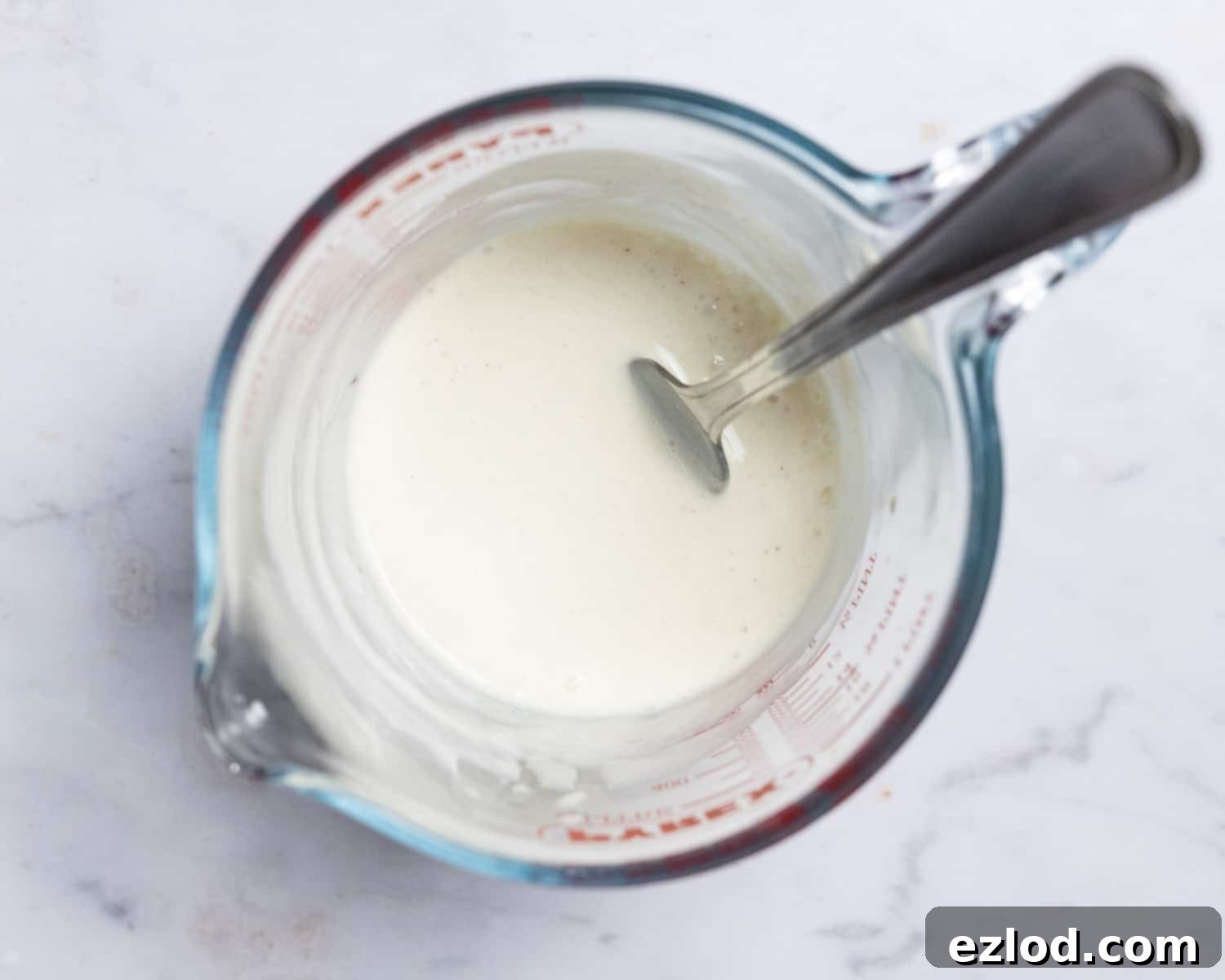 Step 1 - whisking together the wet ingredients for vegan cranberry almond cake.