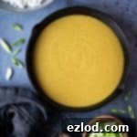 Flavorful Vegan Chinese Curry Sauce 4 A small image of a bowl of vegan Chinese curry sauce with rice and garnishes, complementing the main recipe instructions.