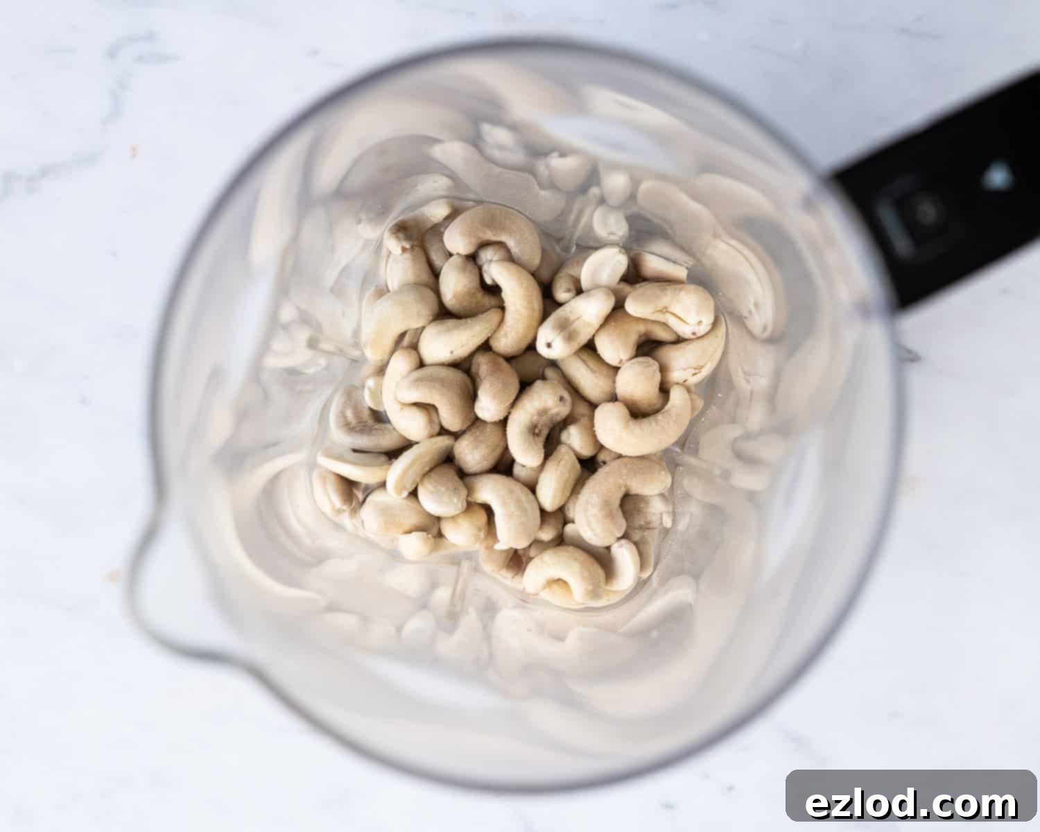 Step 2 - cashews in a blender with water, salt and lemon juice.