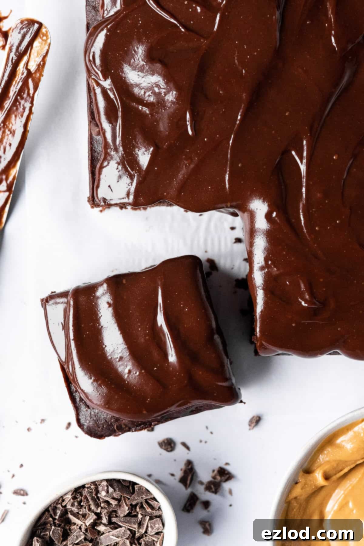 Close up of vegan chocolate banana cake with a piece sliced off.