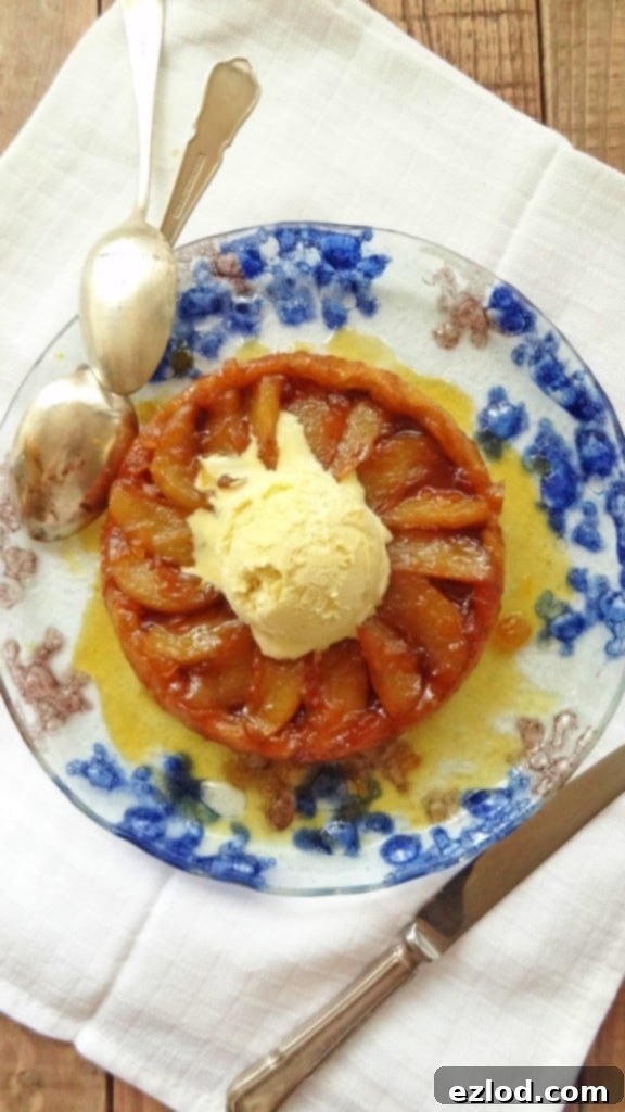 Two mini pear and ginger tarte tatins in cast iron skillets