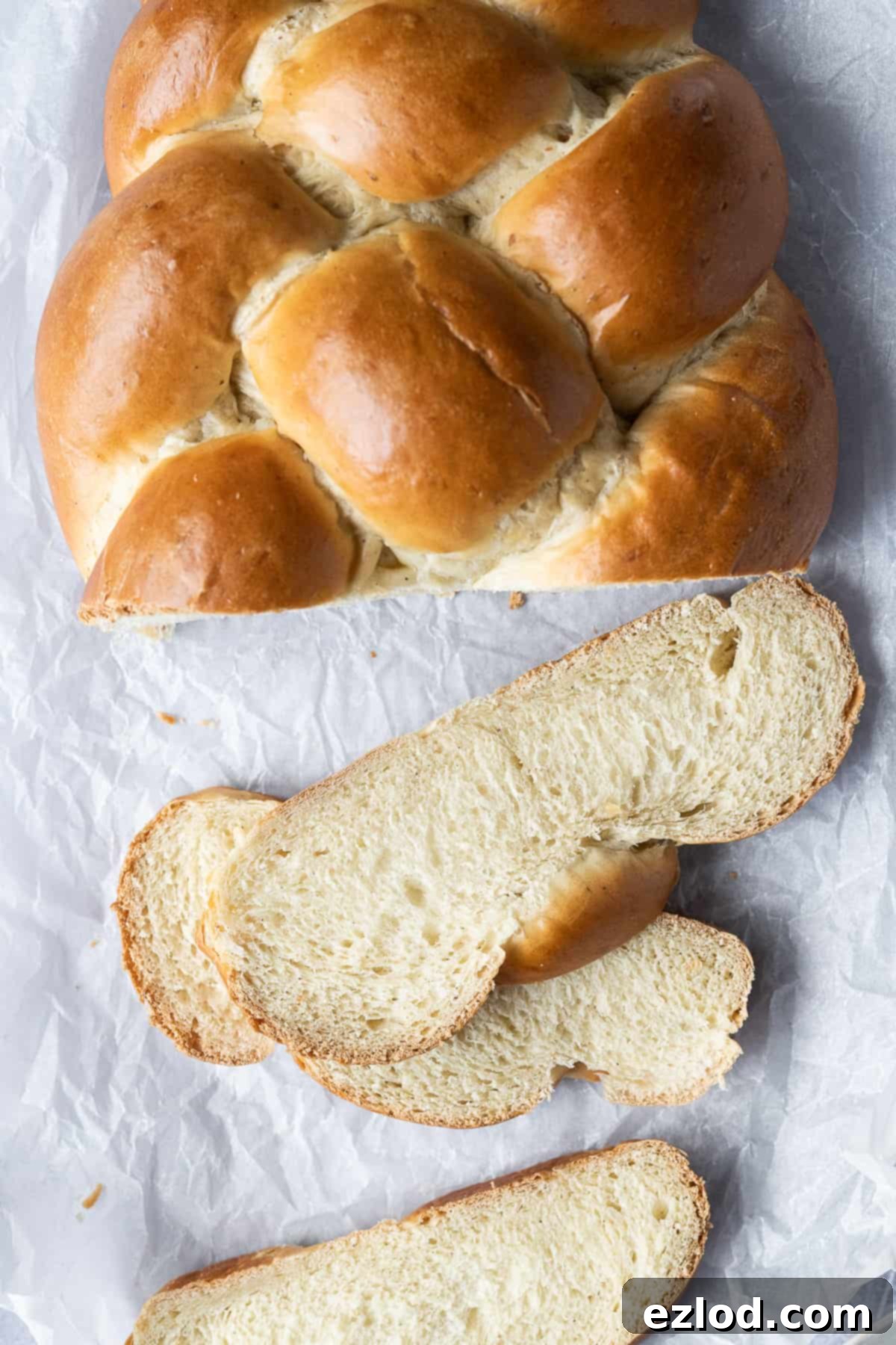 A mouth-watering close-up of individual slices of vegan pulla bread, revealing its tender crumb and the rich infusion of cardamom, perfect for a cozy treat.
