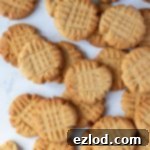 A top-down view of vegan peanut butter cookies, showcasing their inviting texture and golden hue, ready to be enjoyed.