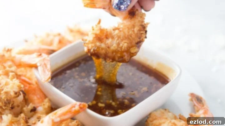 Crispy Coconut Shrimp with a side of sweet chili sauce.