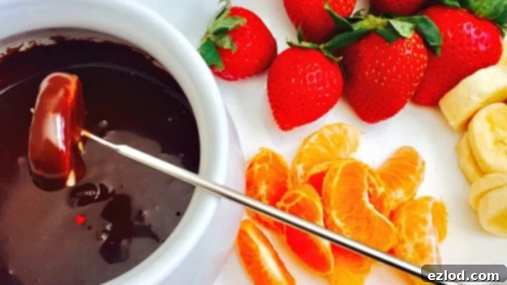 Rich Dairy Free Chocolate Fondue with various dippable fruits and treats.