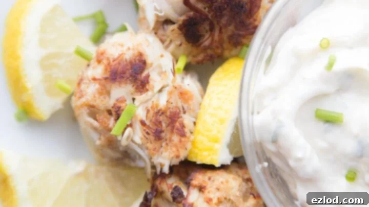 Golden-brown Gluten Free Mini Crab Cakes, served as a gourmet dish.