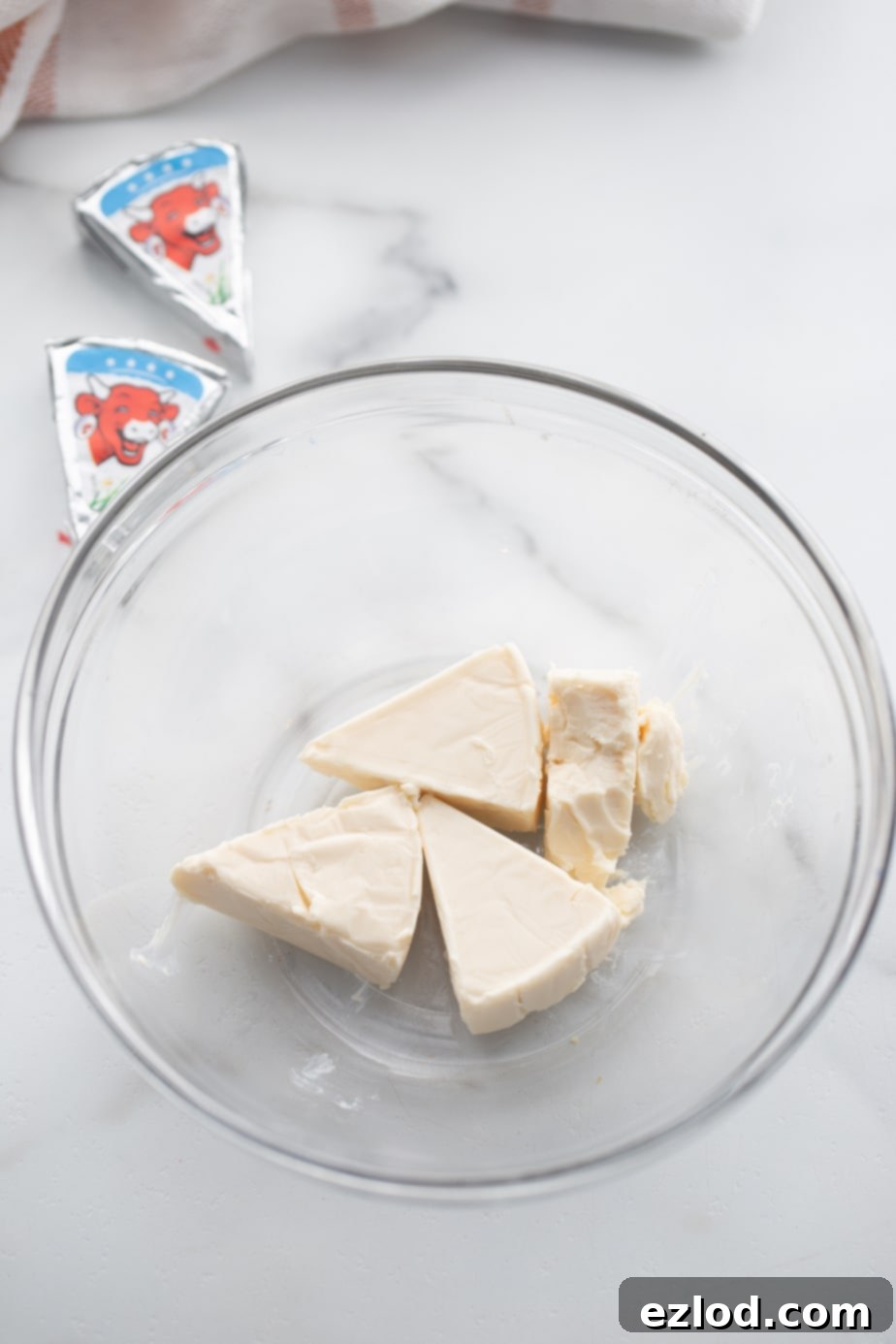Creamy light cheese triangles in a glass bowl