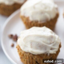 Healthy Carrot Cake Muffins with light cream cheese frosting.