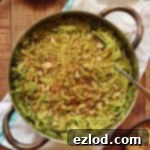 A small portion of spaghetti with kale pesto, mushrooms and pangrattato