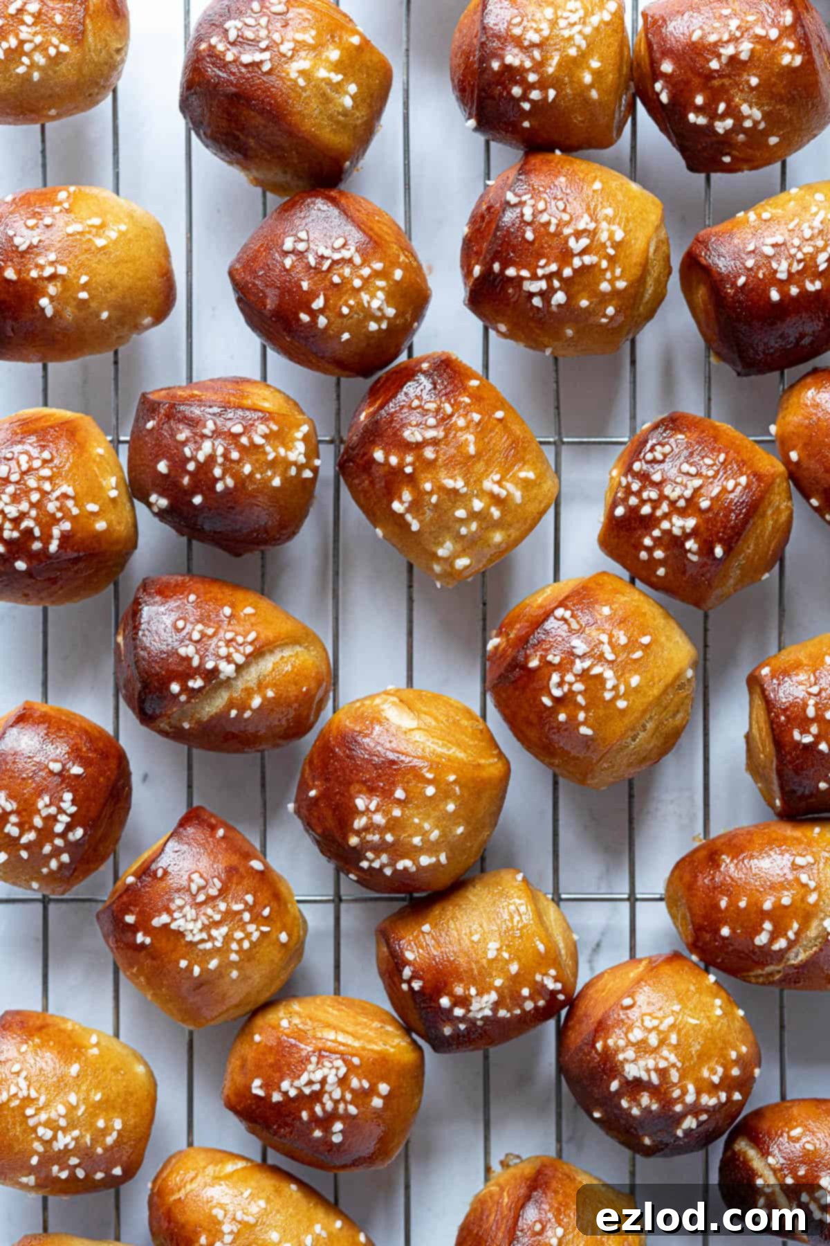 The baked pretzel bites on a wire cooling rack.