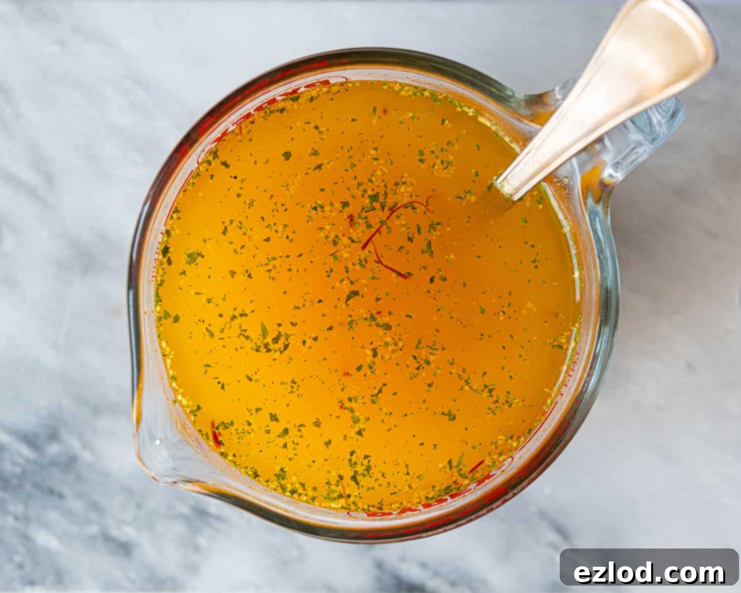 The stock and saffron in a jug.