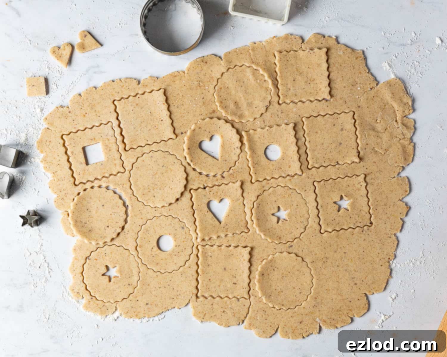 A three-image collage showing the steps of rolling out the cookie dough and cutting out the base and center-cut shapes.