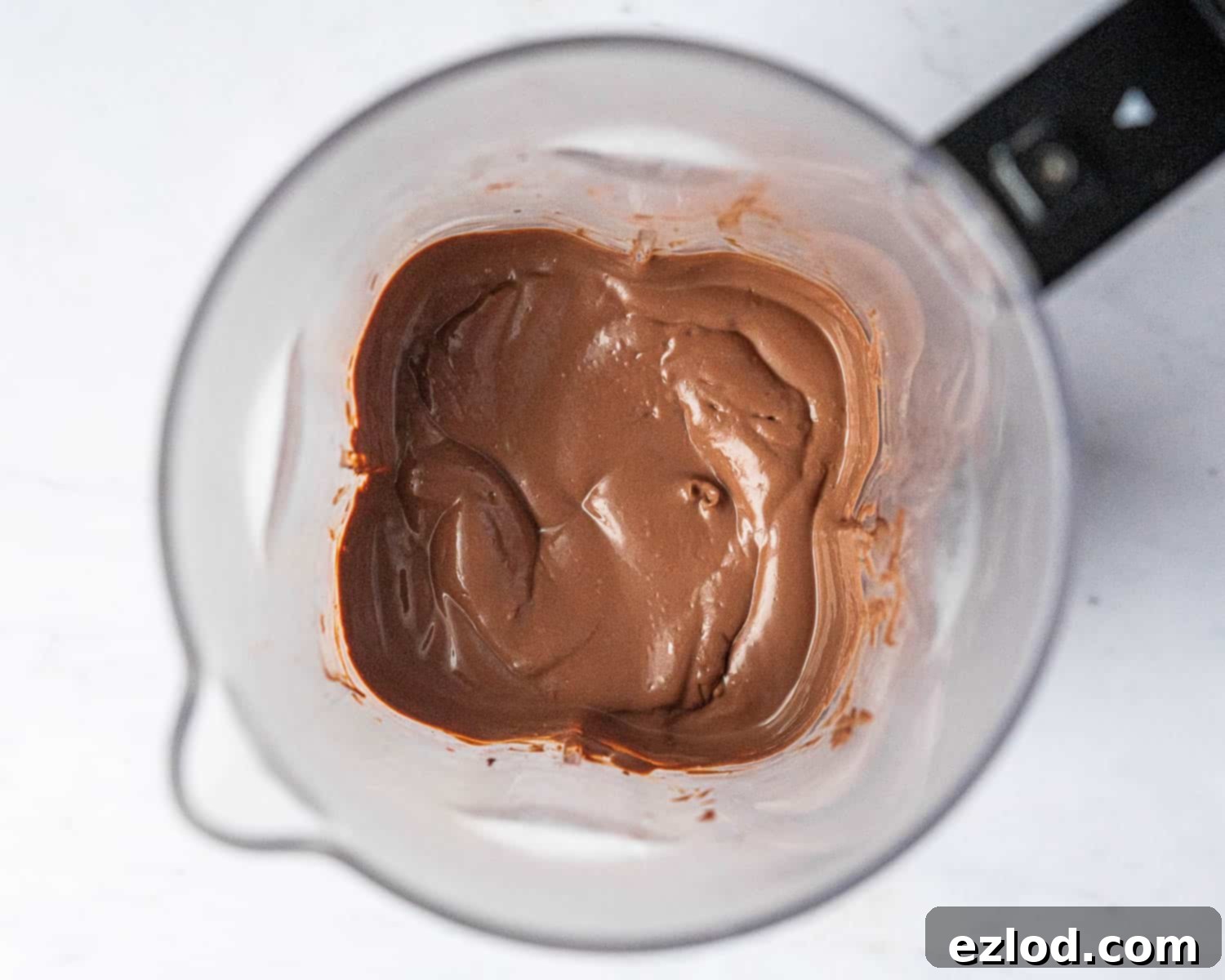 Step 3: A close-up of the perfectly blended vegan chocolate orange mousse mixture inside a blender, showcasing its smooth, consistent texture.