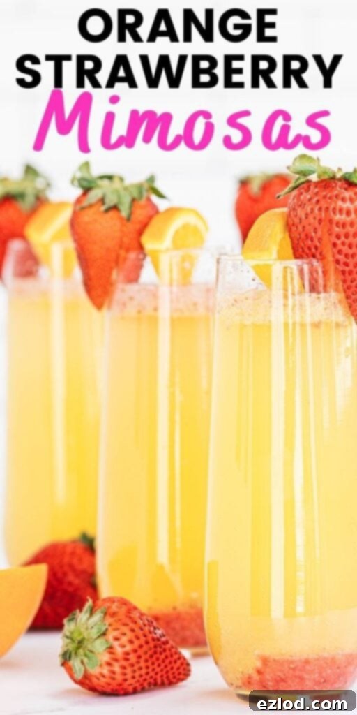 Pinterest image with text overlay: Champagne flutes with orange strawberry mimosas and a strawberry garnish, encouraging sharing on social media