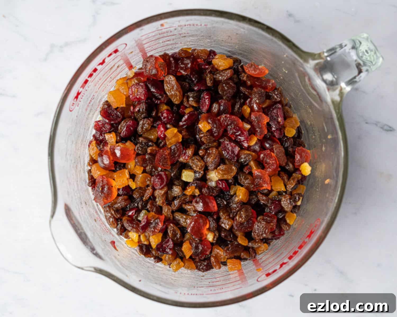 Step 1: Soaked dried fruits resting in a container, ready for baking.