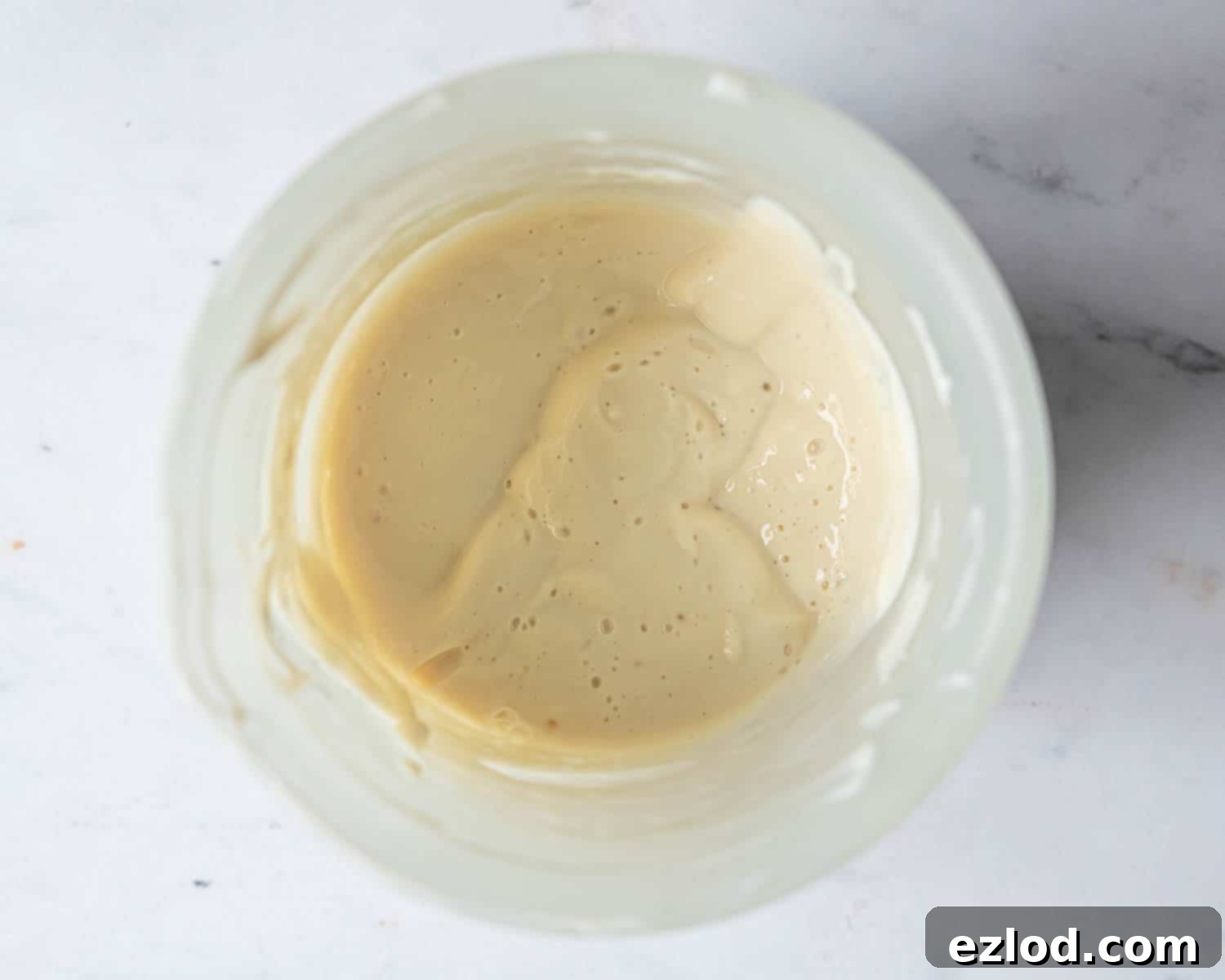 Step 2: The smooth, creamy blended tofu, milk, and vinegar mixture.