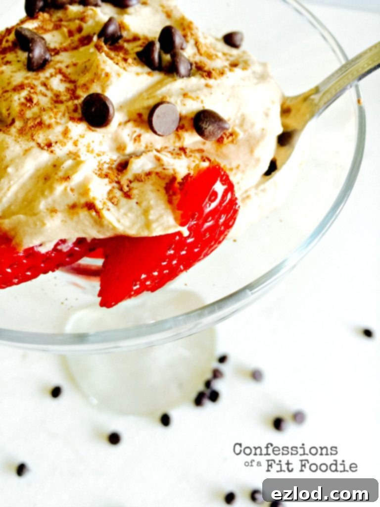 An appetizing close-up of the Cafe Latte Shakeology Whipped Ricotta dessert, topped with cocoa, highlighting its creamy texture and coffee-infused flavor, a healthy twist on Tiramisu.