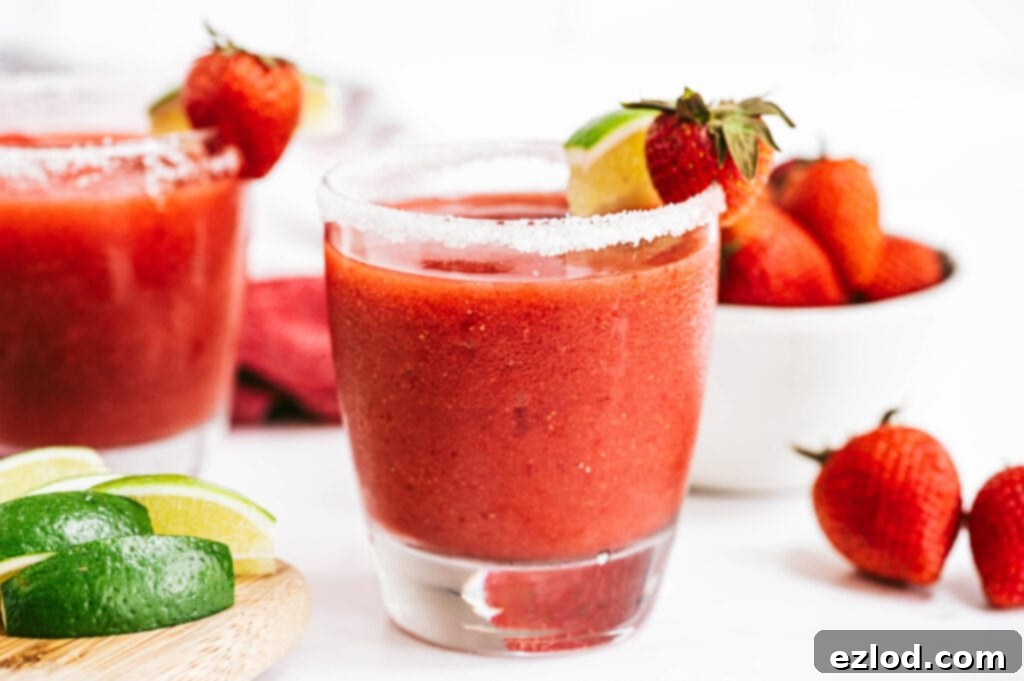 A beautifully composed photo collage featuring a Frozen Strawberry Rhubarb Margarita in a salt-rimmed glass, garnished with lime and strawberries. In the background, there's a bowl of fresh berries and lime slices. The overall aesthetic is bright, fresh, and inviting, showcasing the perfect summer drink.