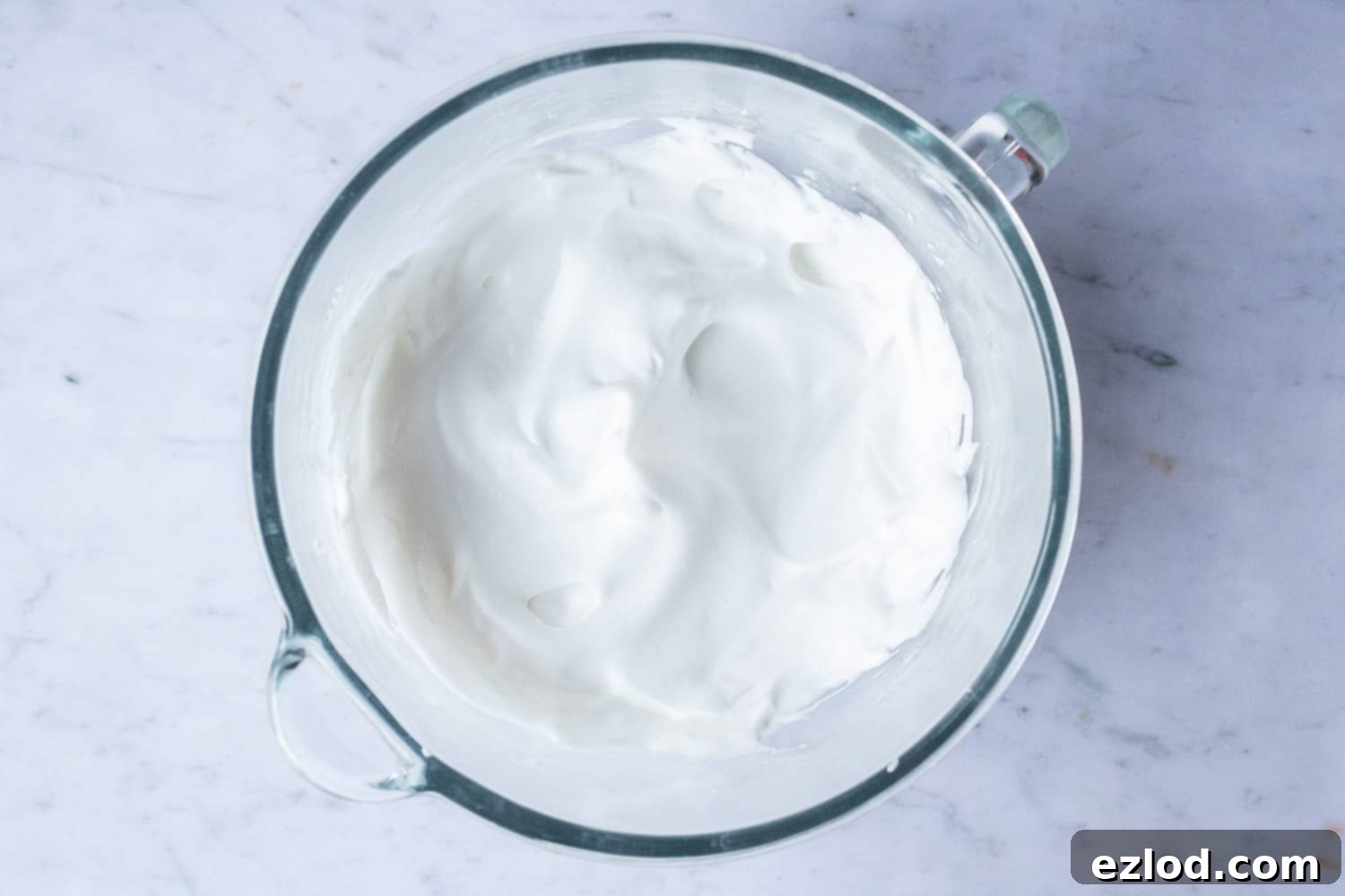 The impeccably whisked aquafaba meringue, forming stiff peaks, ready to be folded into the chocolate ganache.